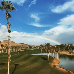 A beautiful community at the heart of all your passions a rainbow over a golf course