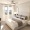 bedroom with bed lamps and windows