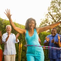 Love where you live a person with a hula hoop as people cheer them on