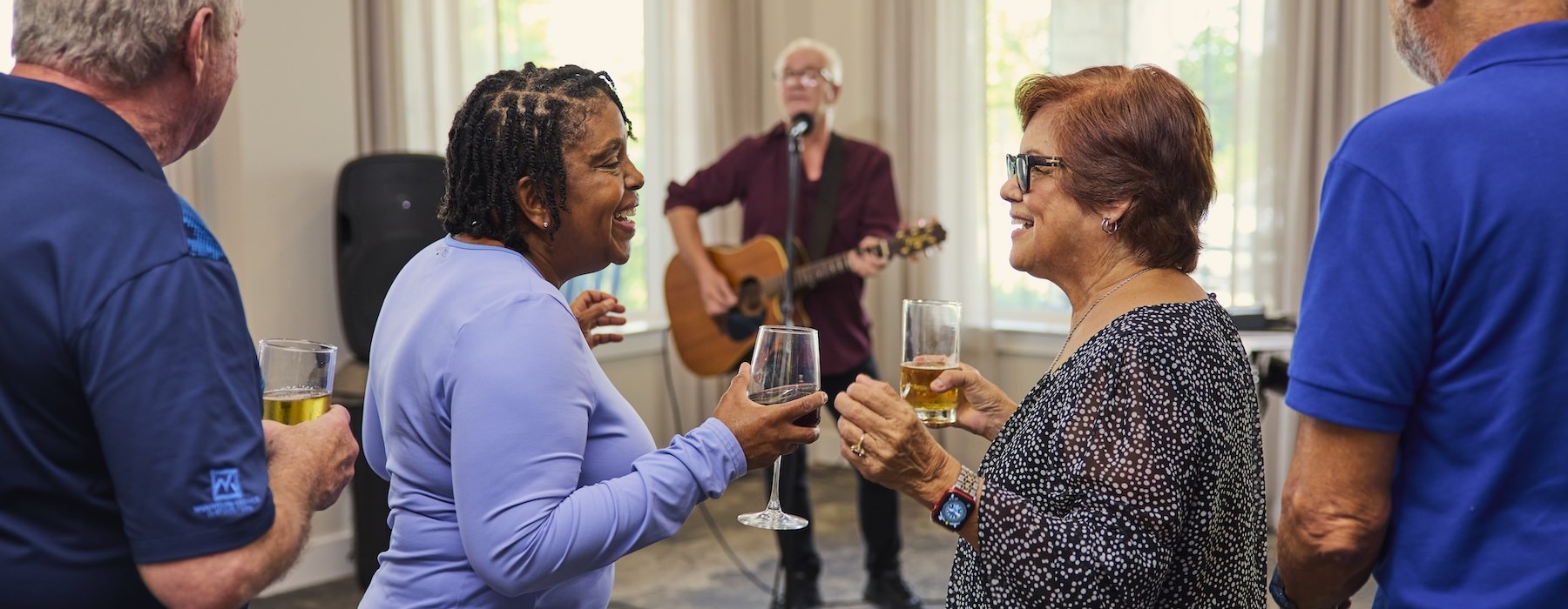 Love where you live two women dancing with a glass of wine