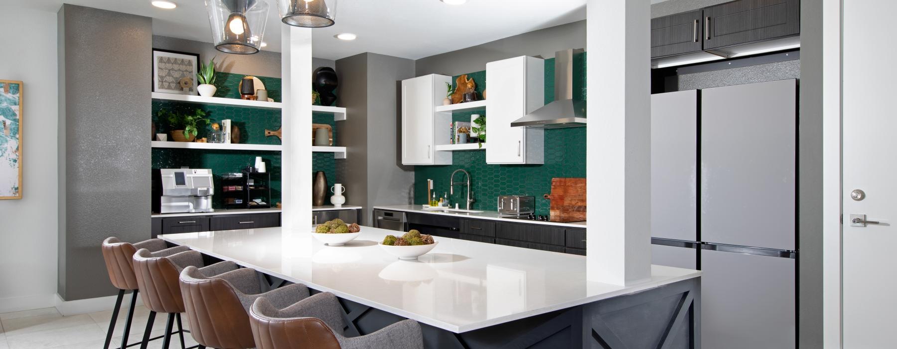 a kitchen with a bar and stools