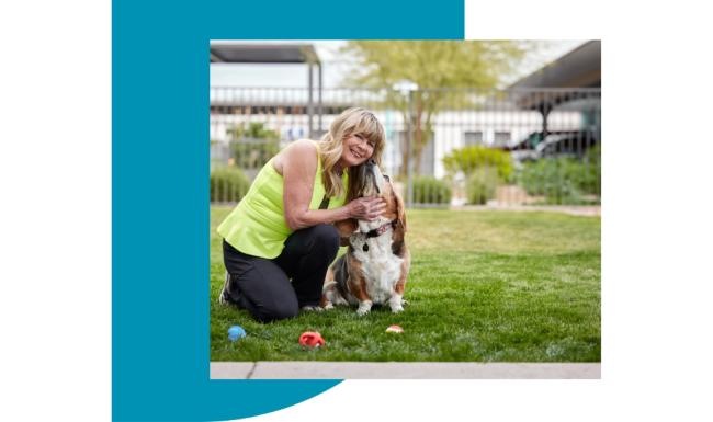 We welcome your pet family a person kneeling down holding a dog