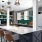 a kitchen with a bar and stools