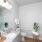 a bathroom with a mirror sink toilet and glass shower